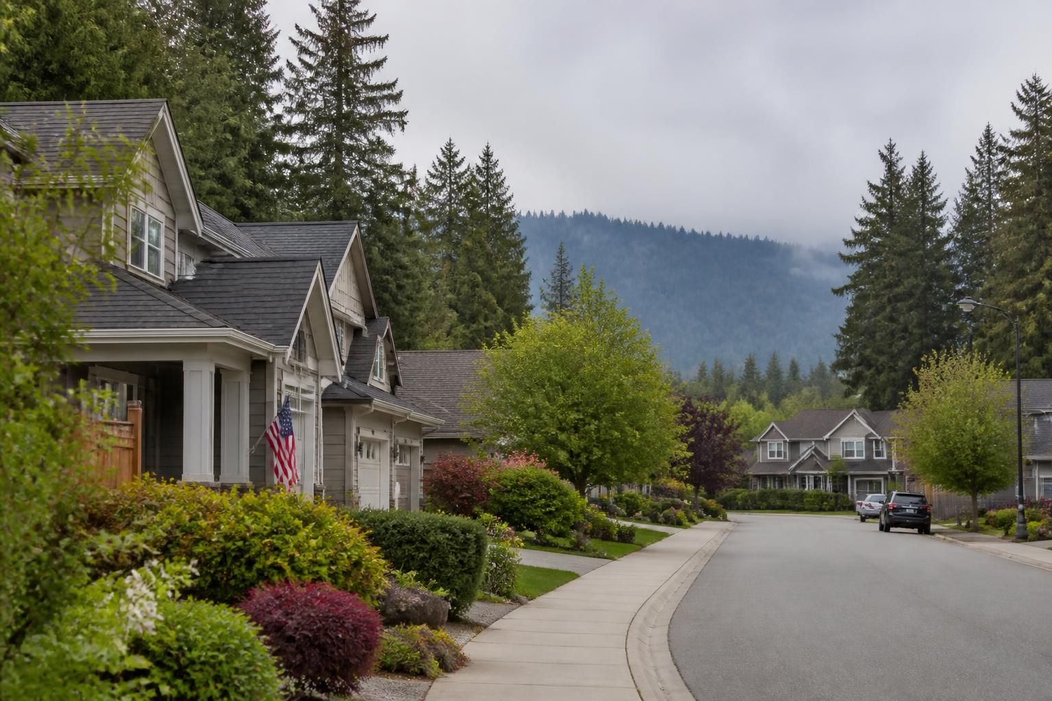 Green neighborhood scene with family homes and soft Pacific Northwest light.